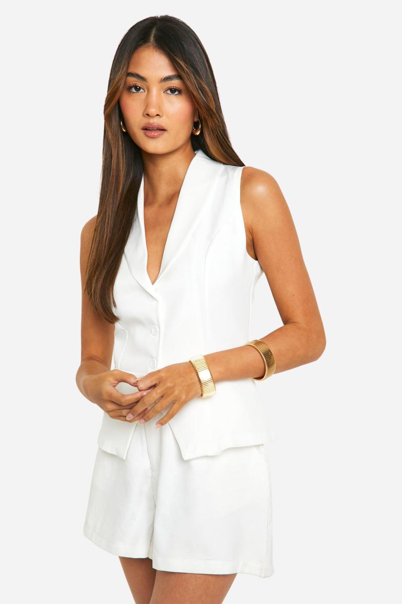 Довгий жилет із розділеним подолом