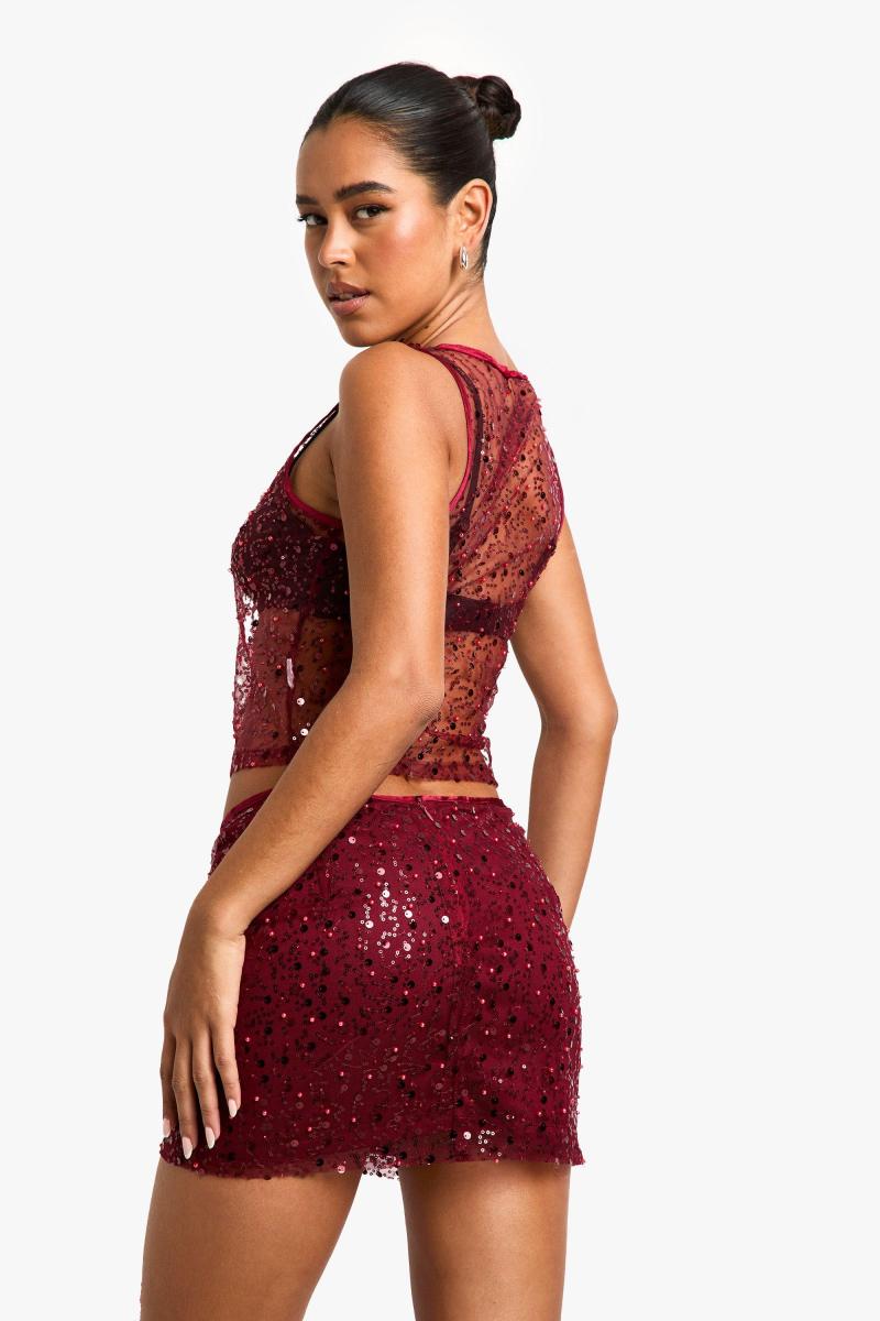 Міні-спідниця з драпіруванням паєтками