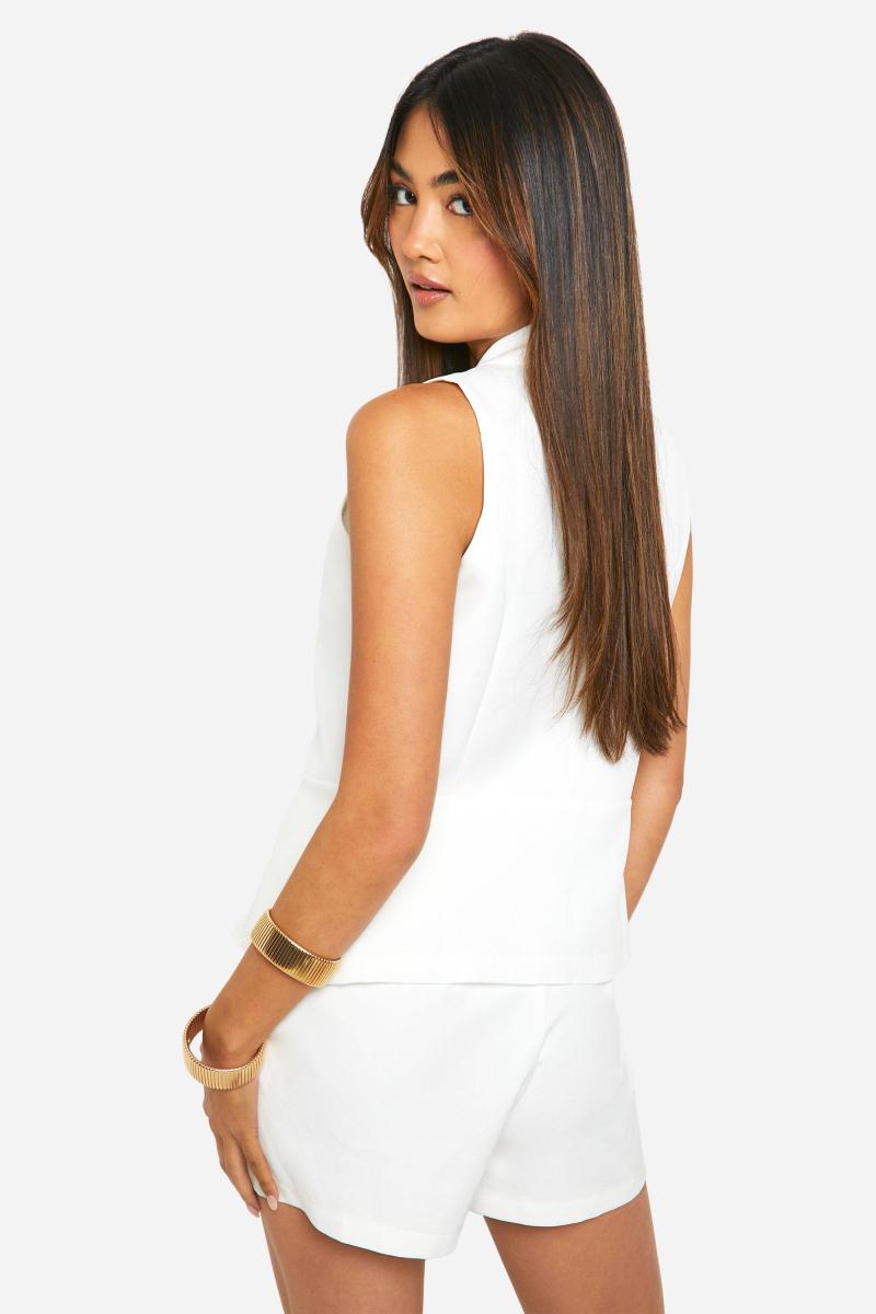 Довгий жилет із розділеним подолом