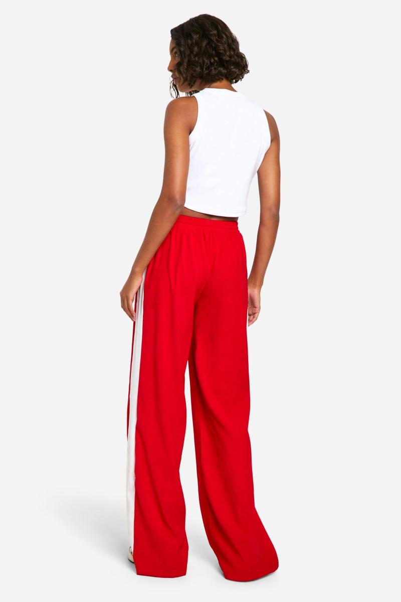 Високі широкі крепові штани в контрастну смужку