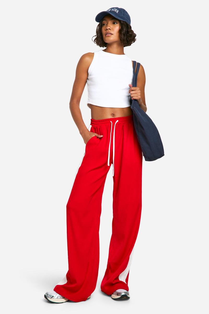 Високі широкі крепові штани в контрастну смужку