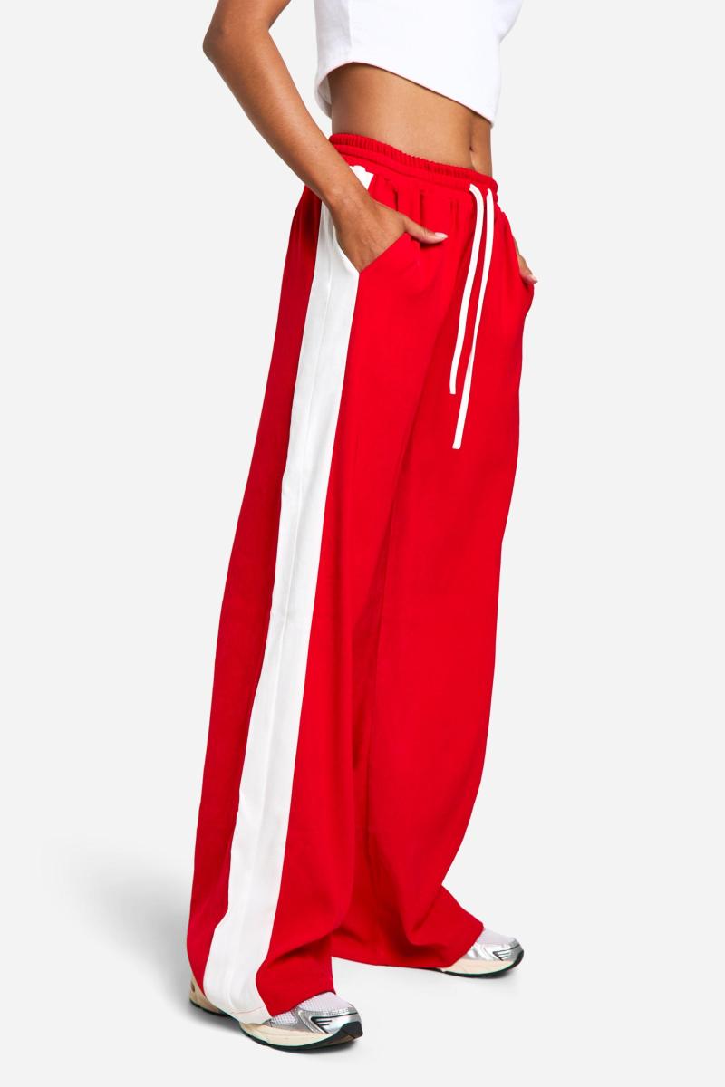 Високі широкі крепові штани в контрастну смужку