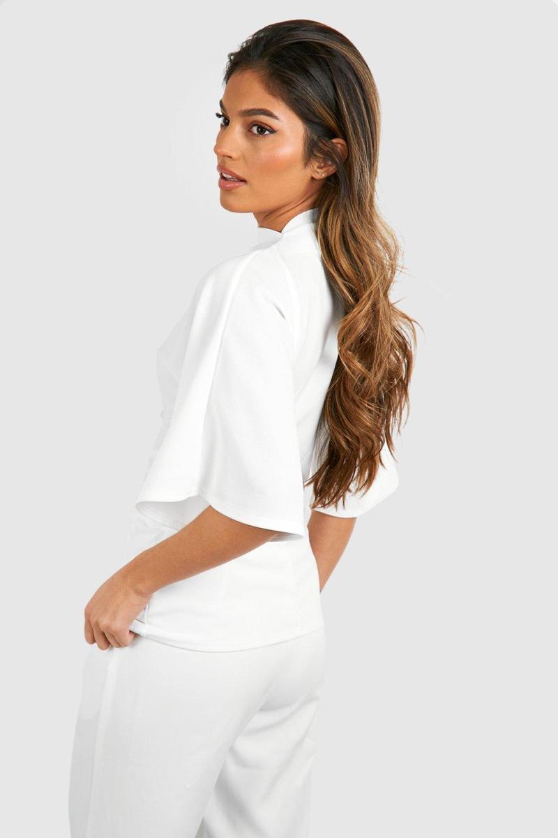 Блуза з розкльошеними рукавами з високою горловиною і крепом із джерсі