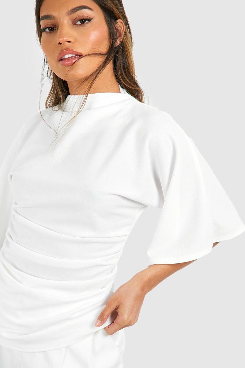 Блуза з розкльошеними рукавами з високою горловиною і крепом із джерсі