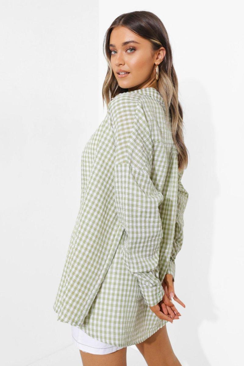 Бузкова оверсайз-сорочка в клітку