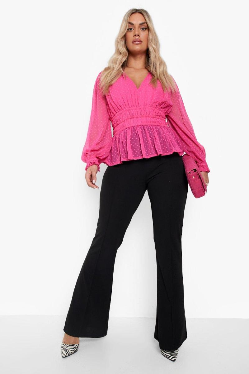 Яскраво-рожева блуза з об’ємними рукавами в сітчасту сіточку
