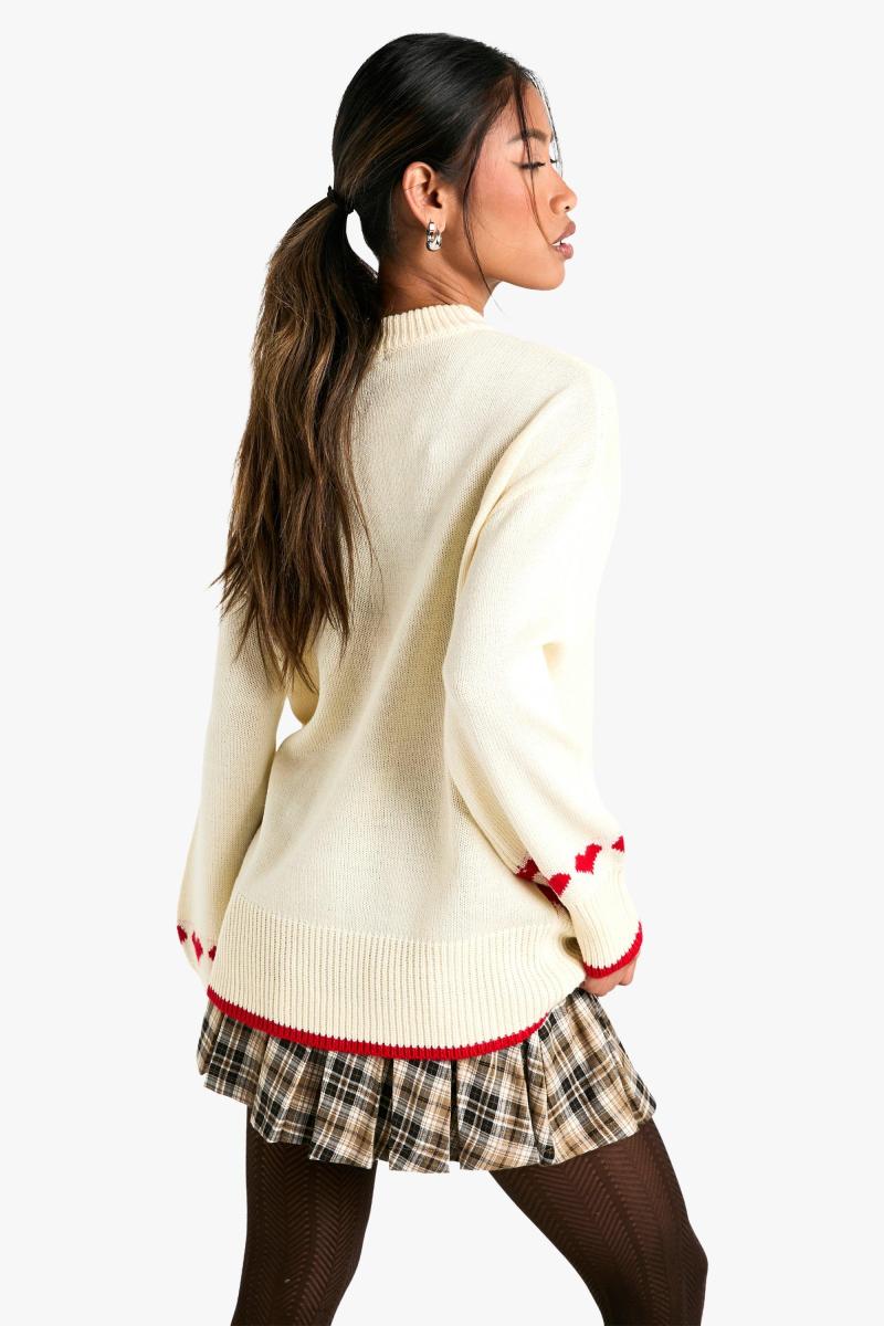 Величезний різдвяний джемпер із сердечками та бантом